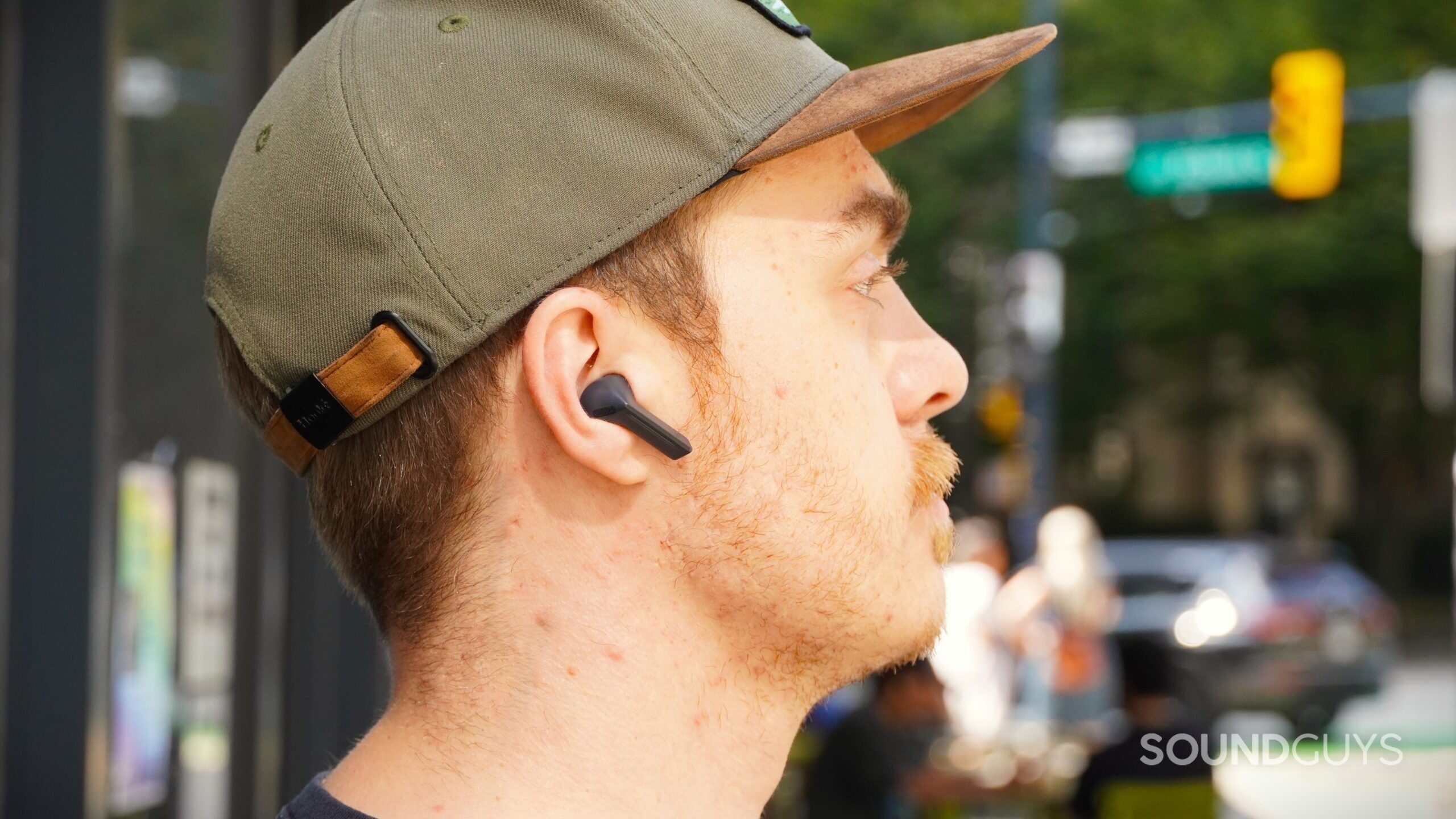 a man wearing the samsung galaxy buds 3 fe