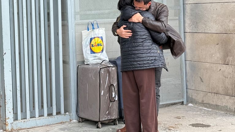 A man welcomes a woman who crossed from Iran to Türkiye at the Kapikoy Border Gate in eastern Van province, Turkey, Thursday, March 5, 2026. 