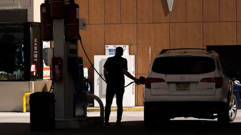 A person fuels up a vehicle at a gas station (file image).