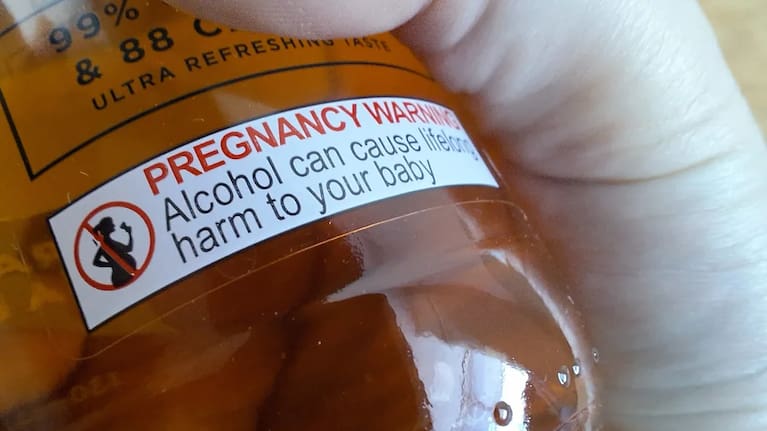A pregnancy warning on an alcoholic drink. 