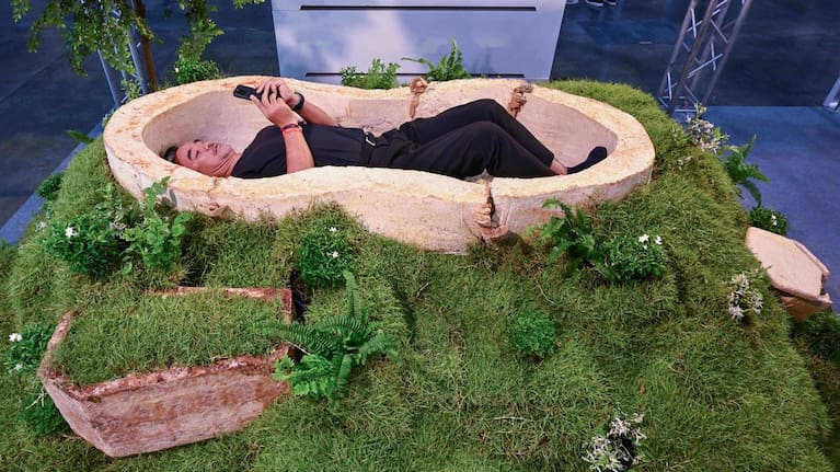 A visitor lies inside a coffin made of mycelium, the rootlike fibres of fungi, at Death Fest in Nonthaburi, Thailand.