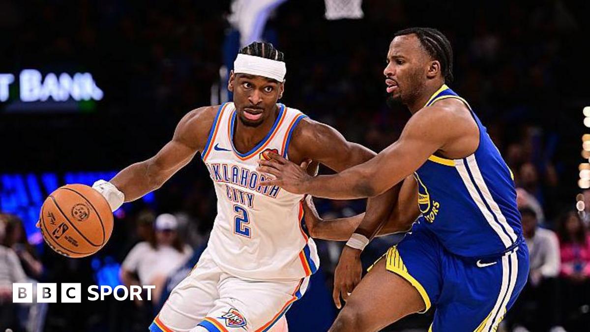 Shai Gilgeous-Alexander of the Oklahoma City Thunder attempts to drive past Lj Cryer of the Golden State Warriors