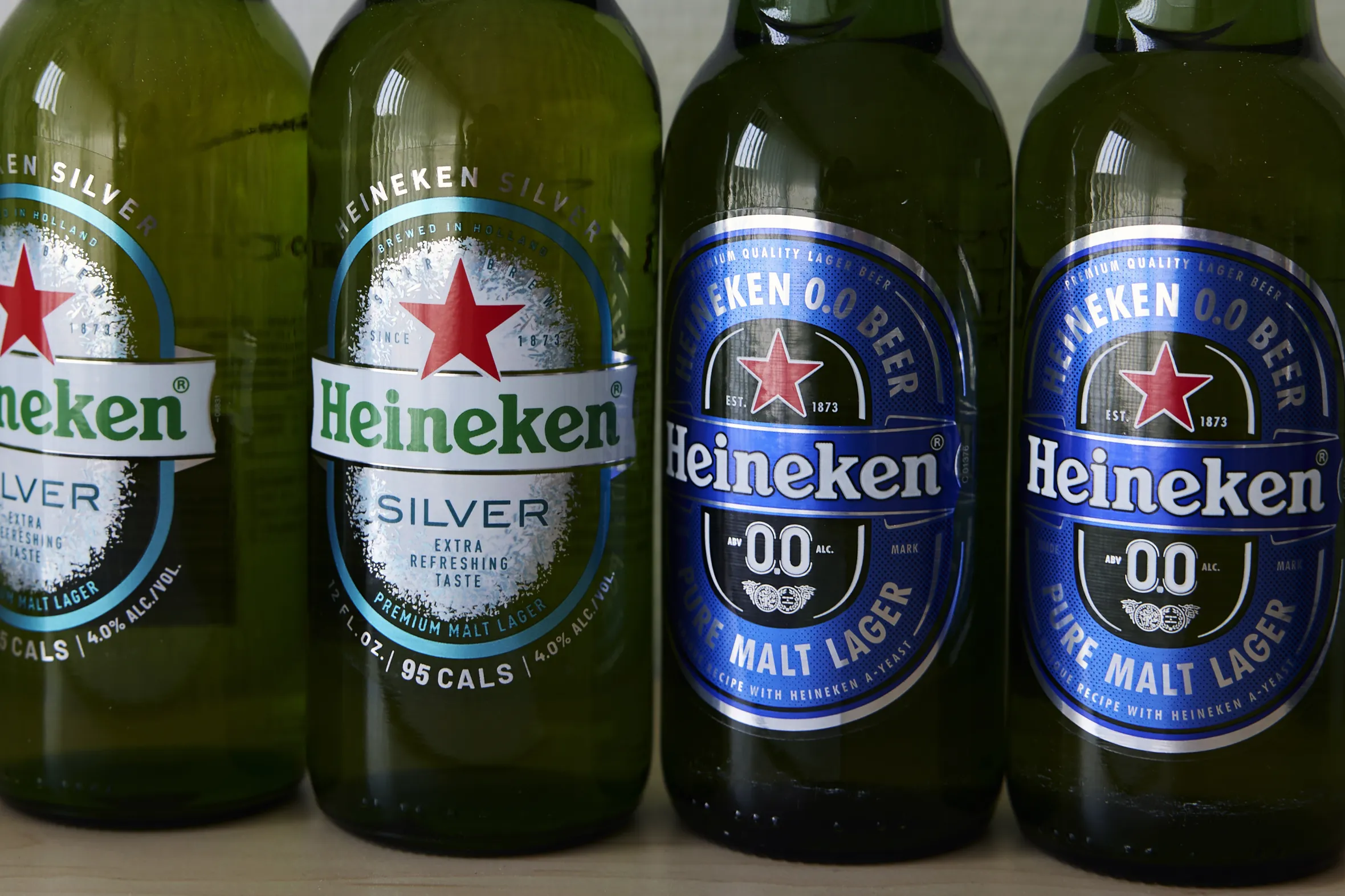 Arrangement of Heineken Silver and Heineken 0.0 Beer bottles.