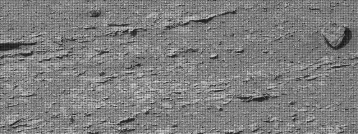 The surface of mars is craggy, making the object stand out more (NASA)