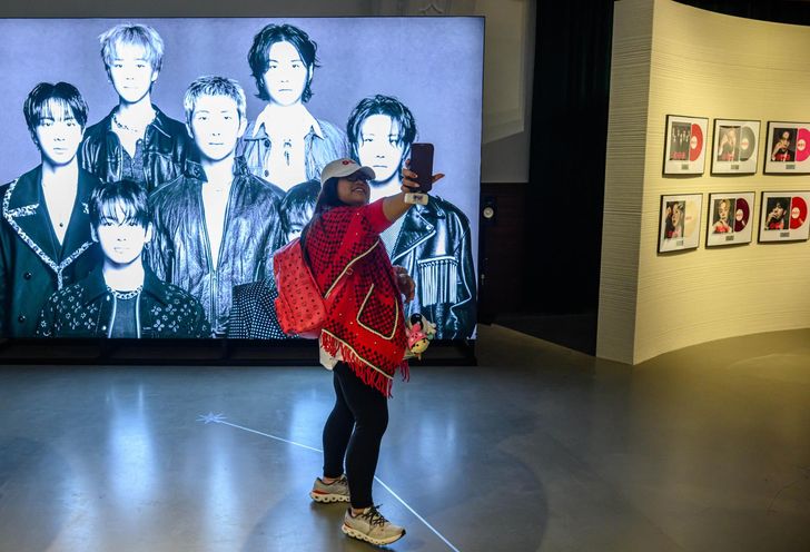 BTS fan Sweet Tappan poses at BTS Pop-up: ARIRANG in Seoul, Korea, Friday, one day before the band's comeback performance. Korea Times photo by Shim Hyun-chul
