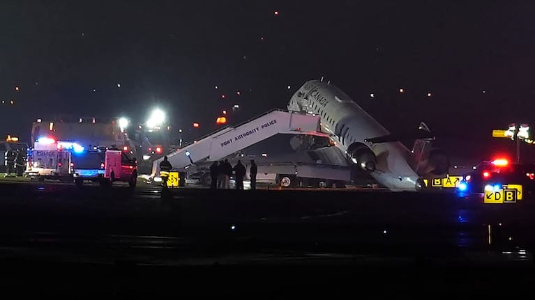 An Air Canada Jet sits on the runway at LaGuardia Airport, Monday, March 23, 2026, after colliding with a Port Authority vehicle in New York.