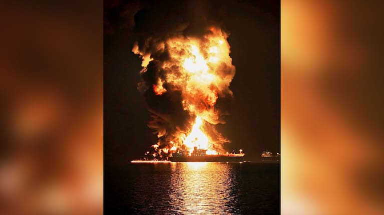 An oil tanker burns after being hit by an Iranian strike in the ship-to-ship transfer zone at Khor al-Zubair port near Basra, Iraq, late Wednesday, March 11, 2026.