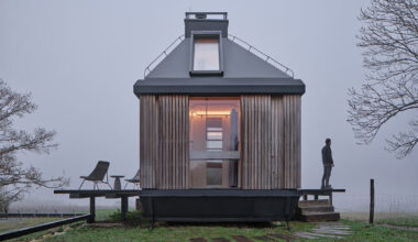 ark-shelter & archekta craft off-grid cabin with a fold-down facade in devín, slovakia
