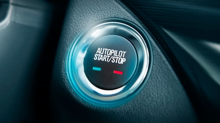Autopilot button in the car stock photo. (File image). 