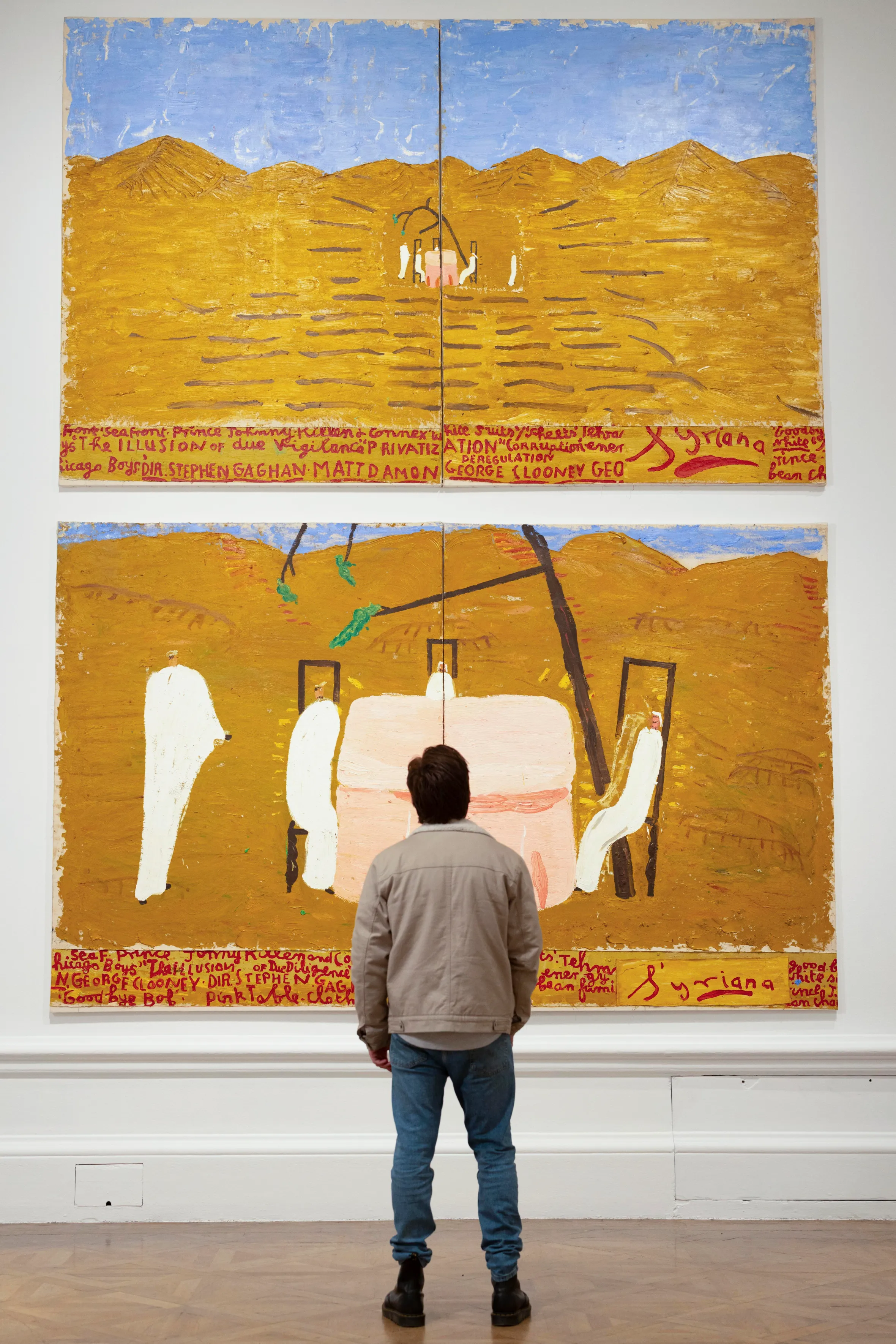 A person views two large paintings, each a diptych, by Rose Wylie from The Picture Comes First exhibition at the Royal Academy of Arts.