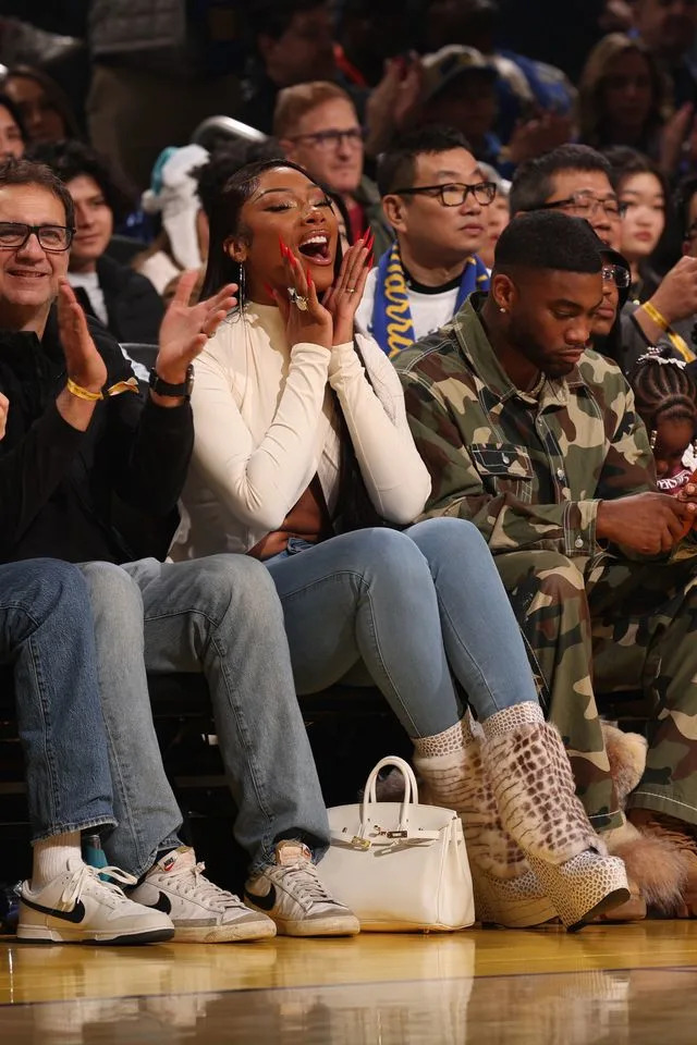 Megan Thee Stallion cheers on Klay Thompson from the sidelines at a Maverick's game on December 25, 2025.Credit: Getty Images