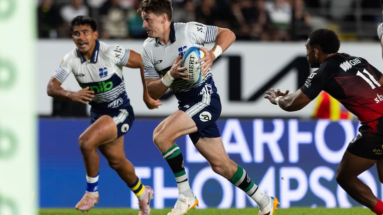 Beauden Barrett makes a break during the Blues' victory over the Crusaders at Eden Park.