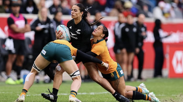 Black Fern Stacey Waaka is crunched in a double tackle against Australia in the Cup final in New Jersey.