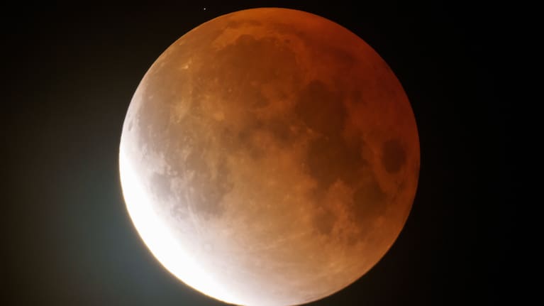 The full Worm Moon glows orange as it begins to emerge from totality during a lunar eclipse in the early morning hours of Tuesday, March 3, 2026, near Moscow, Idaho.