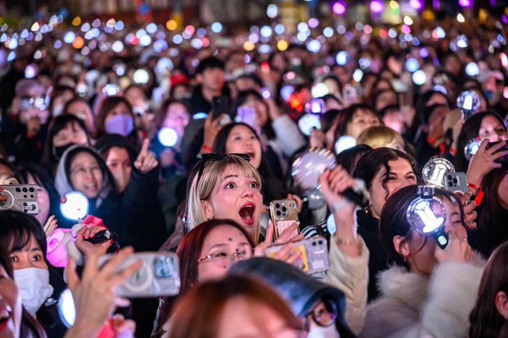 Fans excitedly watch BTS as it returns as a full group during its comeback concert in Seoul, Saturday. Korea Times photo by Shim Hyun-chul