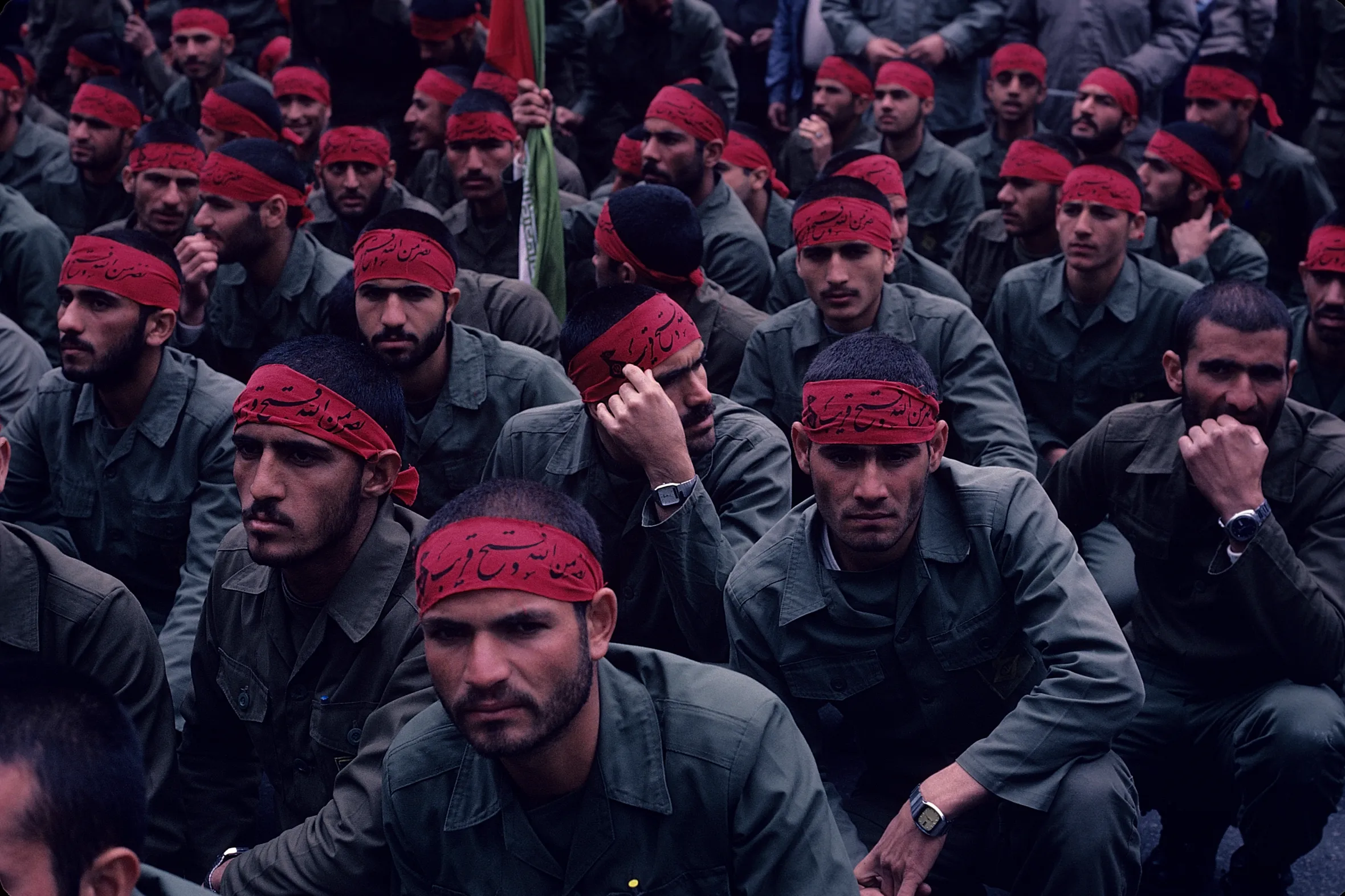 Iranian Revolutionary Guards in red headbands gather in Imam Hussein Square in Tehran, during the Iran-Iraq War.