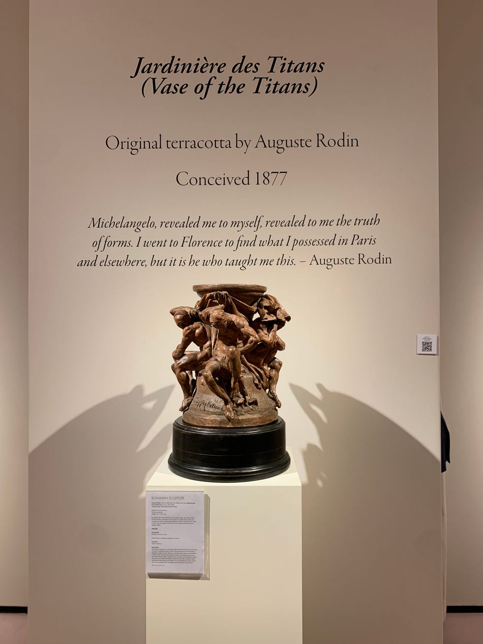 Terracotta sculpture titled 'Jardinière des Titans' by Auguste Rodin displayed on a pedestal.