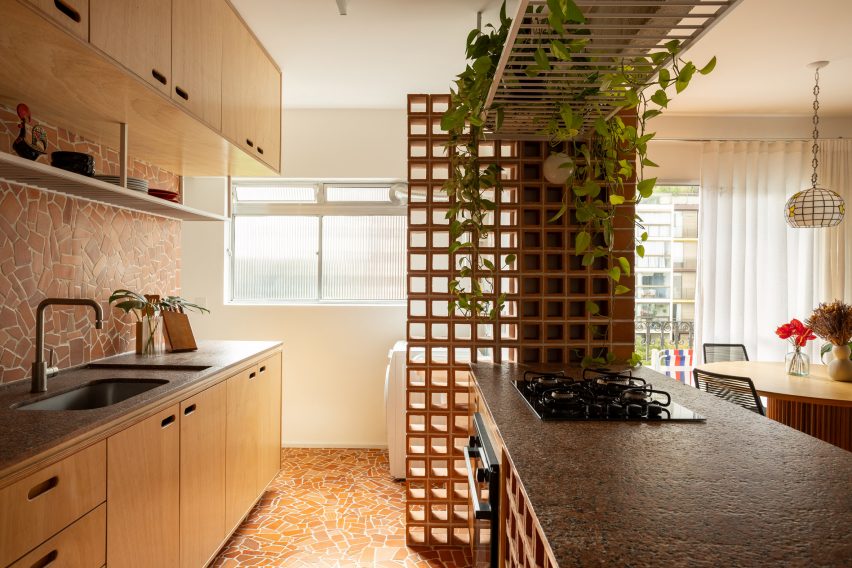 Cobogó blocks help to disguise a laundry area tucked at the back of a kitchen