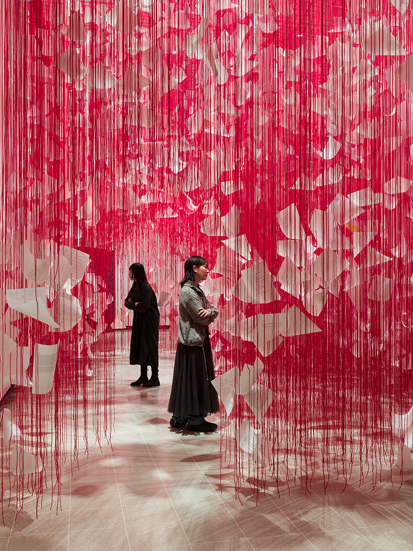 chiharu shiota's woven webs meet yin xiuzhen's clothing installations at hayward gallery - 3
