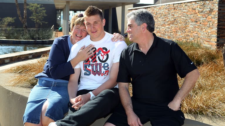 Chris's parents Grant and Julie were very involved in his football career from the beginning. 