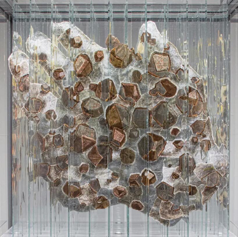 anamorphic installation by thomas medicus rotates into four shifting hand images - 1