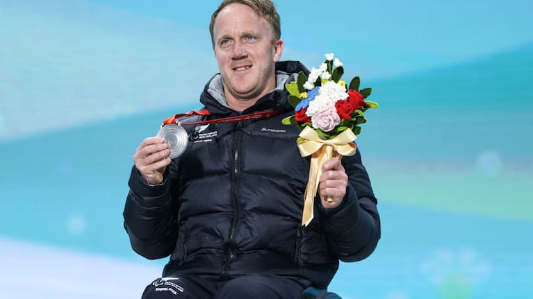 Silver medallist Corey Peters of Team New Zealand poses during the Para Alpine Skiing Men’s Super G Sitting medal ceremony on day two of the Beijing 2022 Winter Paralympics at Yanqing Para Medals Plaza on March 06, 2022 in Yanqing, China.