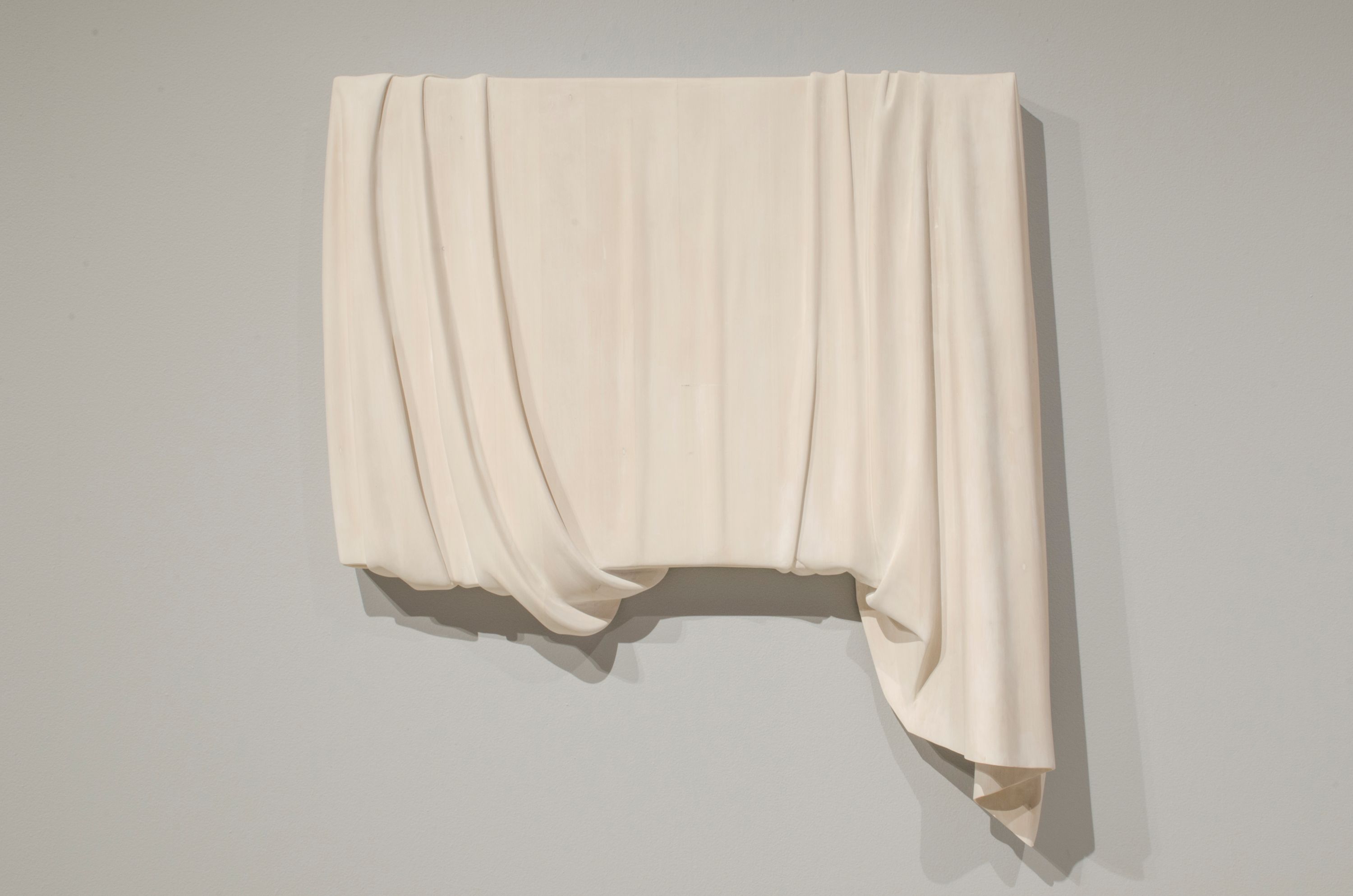The men who sold lies by Abdul-Rahman Abdullah, a sculpture that resembles a painting concealed by a draped white cloth.