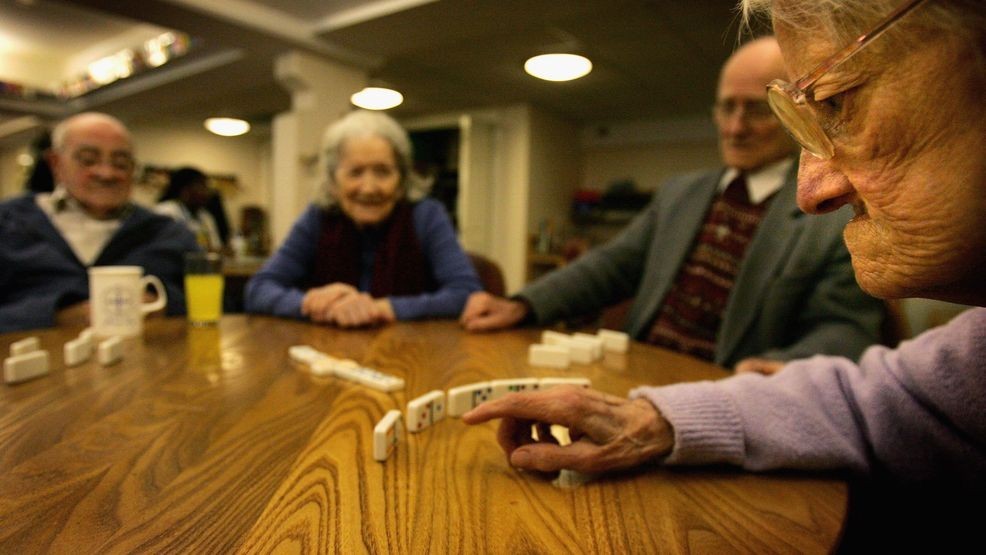 LONDON - MAY 19: Peggy checks her hand during a game of dominoes on May 19, 2006 in London, England. A deal on pensions has been agreed between Tony Blair and Gordon Brown and an age rise for when the pension can be taken, from 65 to 68 is likely to be enforced by the year 2050. (Photo by Daniel Berehulak/Getty Images)