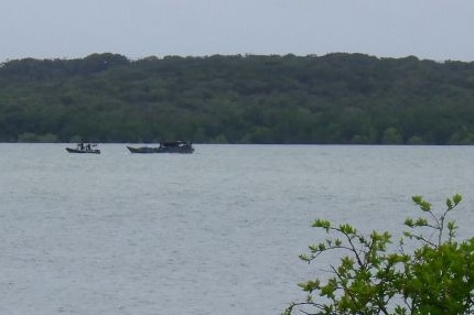 One boat towing another.