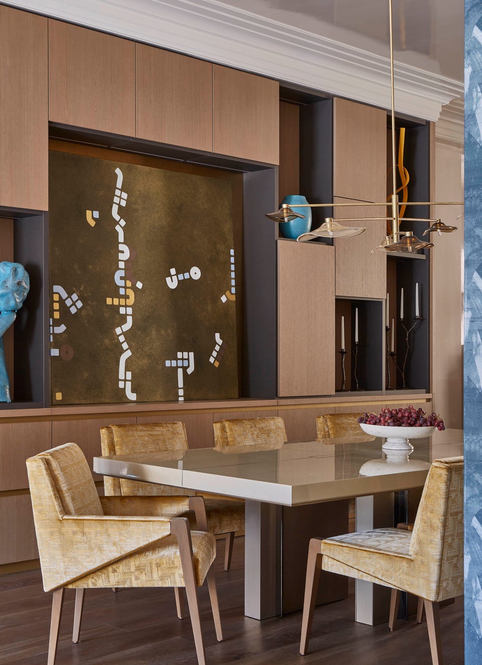 Modern dining area featuring a table and stylish chairs.