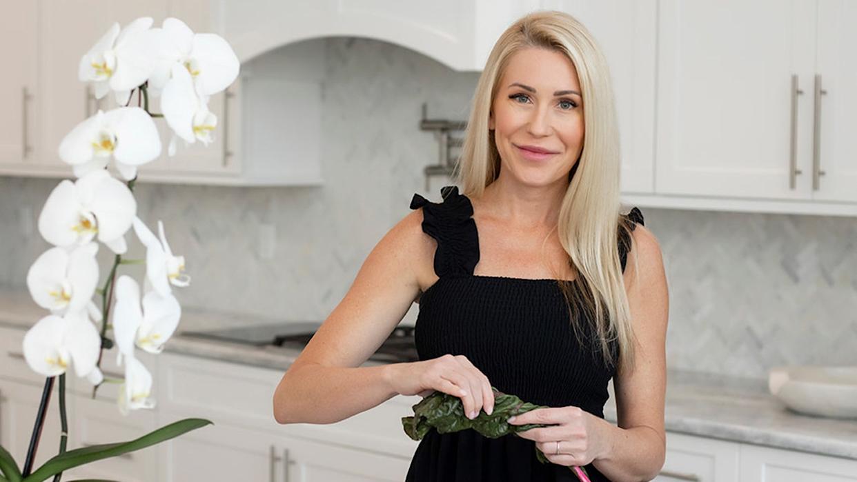 Lee Cotton smiles in her kitchen.