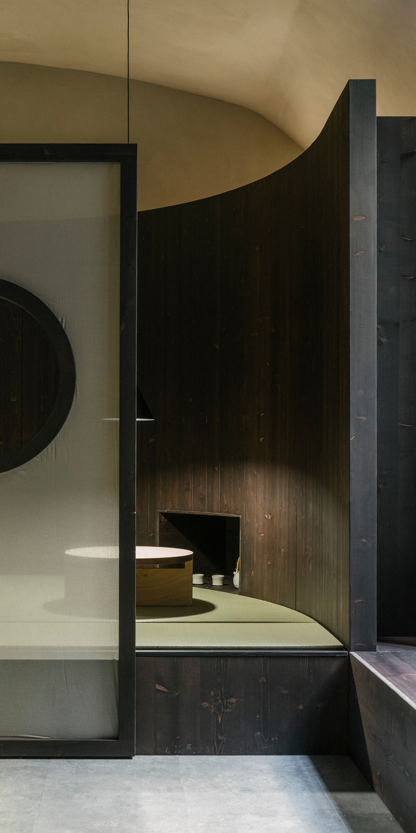 perforated wooden screens filter light and shadow within milan ceramic workshop - 7