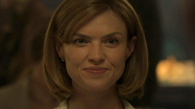 Erin Richards as Kelly Fisher smiling in The Crown
