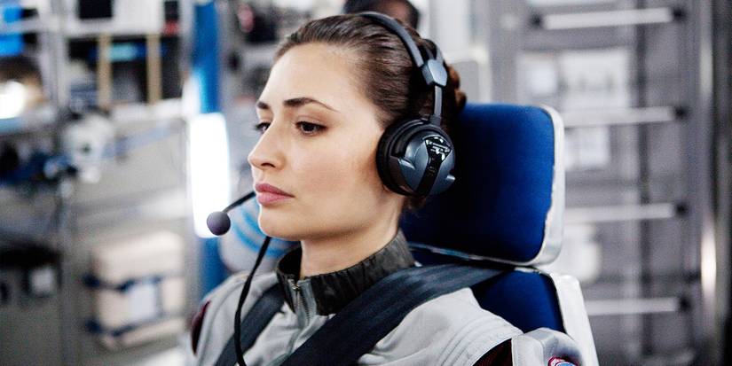 Karolina Wydra's Katya seated wearing a headset in Europa Report
