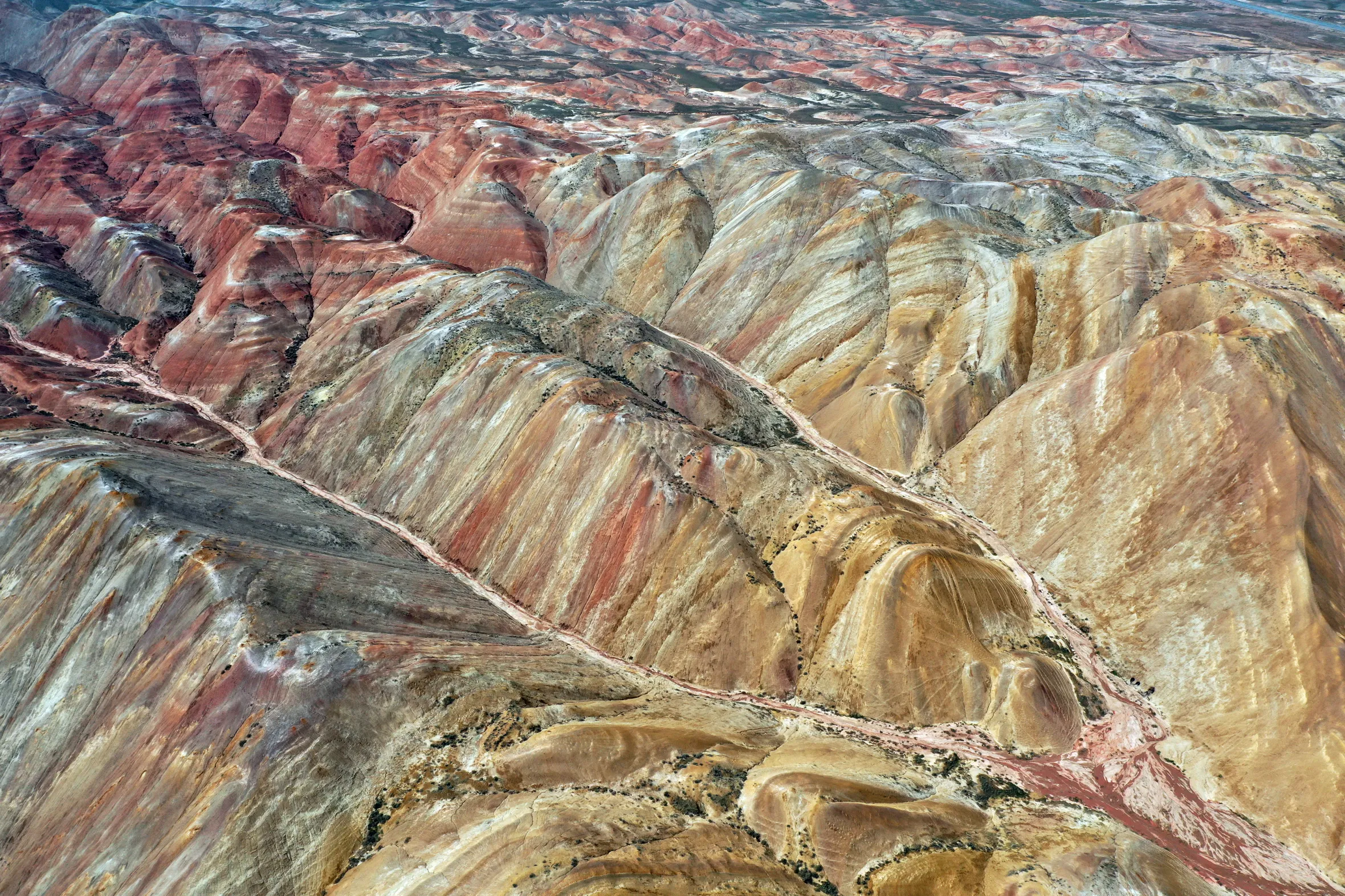 The Rainbow Hills in Igdir, Turkiye, reveal vibrant spring colors as the winter snow melts.