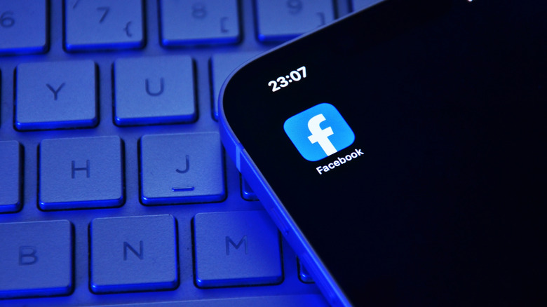 facebook app icon open on phone screen