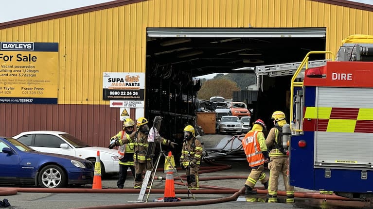 Firefighters at the scene of a fire at a car wrecking yard in Upper Hutt.