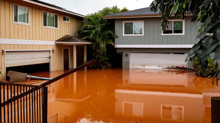 Floodwaters fill the ground level of homes in Waialua, Hawaii.
