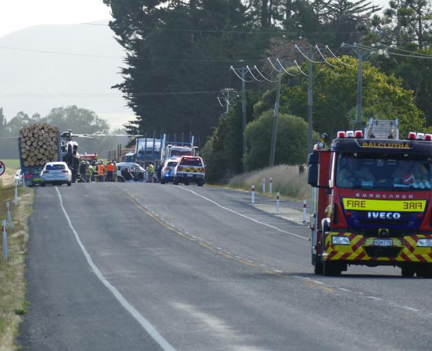 Emergency services at the scene of the crash just south of Milton this morning. Photo: Richard...