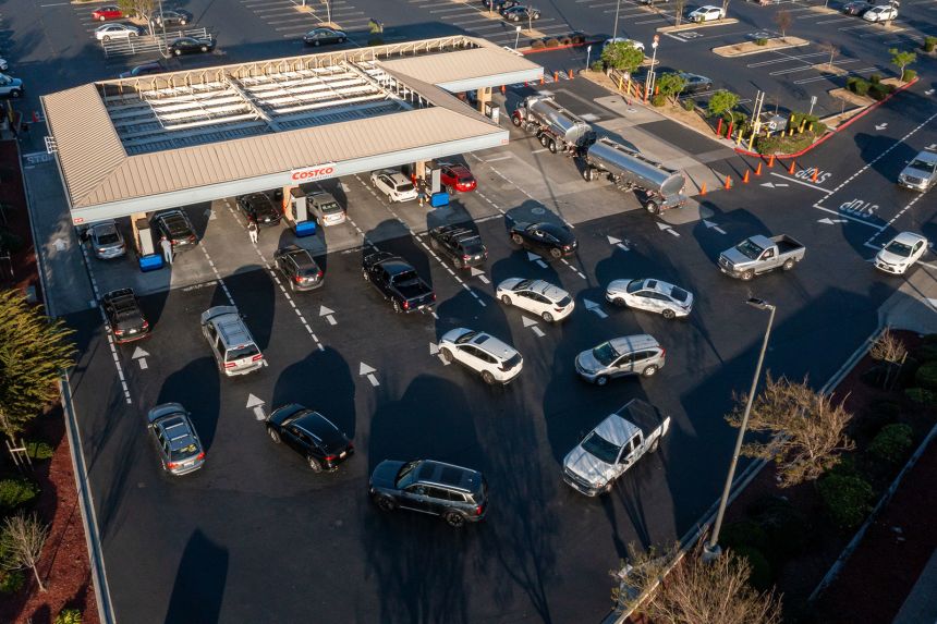 Drivers wait to refuel vehicles at a Costco gas station in Richmond, California.