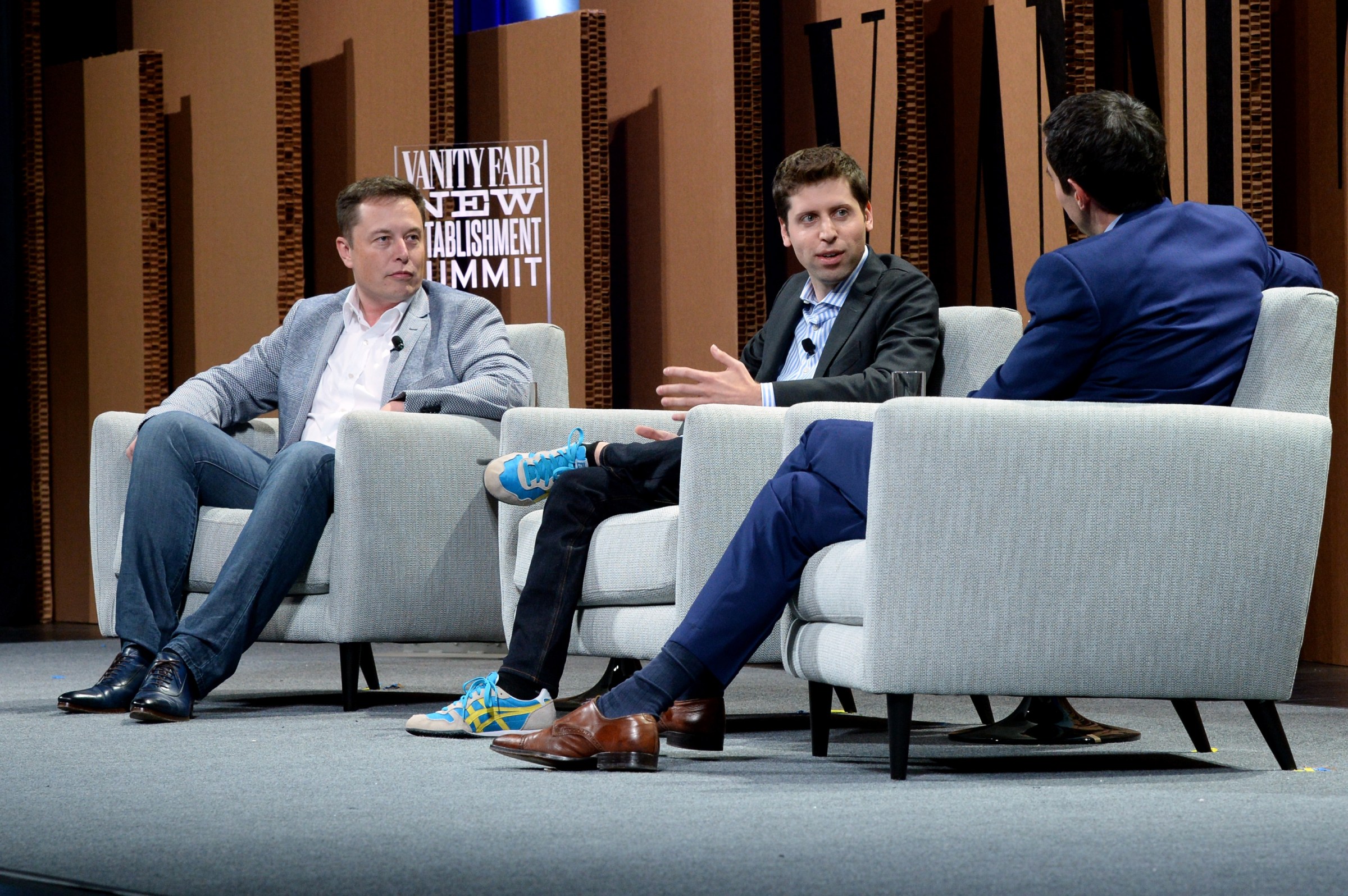 Elon Musk and Sam Altman speak on a panel together for Vanity Fair in 2015.