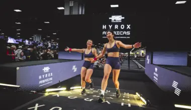 women cross the finish line at a Hyrox event