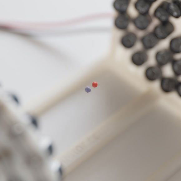 Morrell et al. observed a new type of time crystal -- one whose particles levitate on a cushion of sound while interacting with each other by exchanging sound waves. Image credit: David Song / NYU.