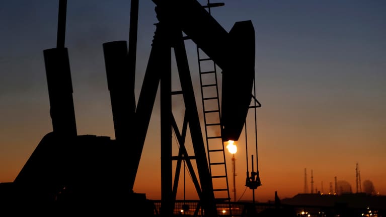 In this January 18, 2016 file photo, an oil pump works at sunset, in the desert oil fields of Sakhir, Bahrain.