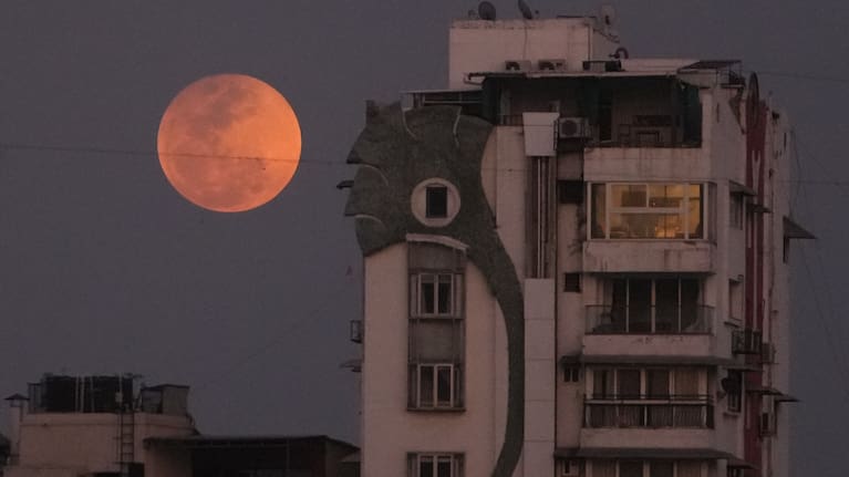 A blood moon rises over Ahmedabad, India, Tuesday, March 3, 2026.