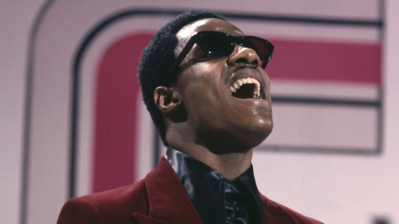 Stevie Wonder belting out a song on TV