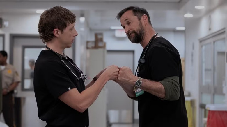 Dr. Whitaker and Dr. Robby bumping fists