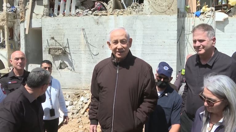 Israeli leaders visited one of two southern communities near a secretive nuclear research site struck by Iranian missiles late Saturday, with scores of people wounded.