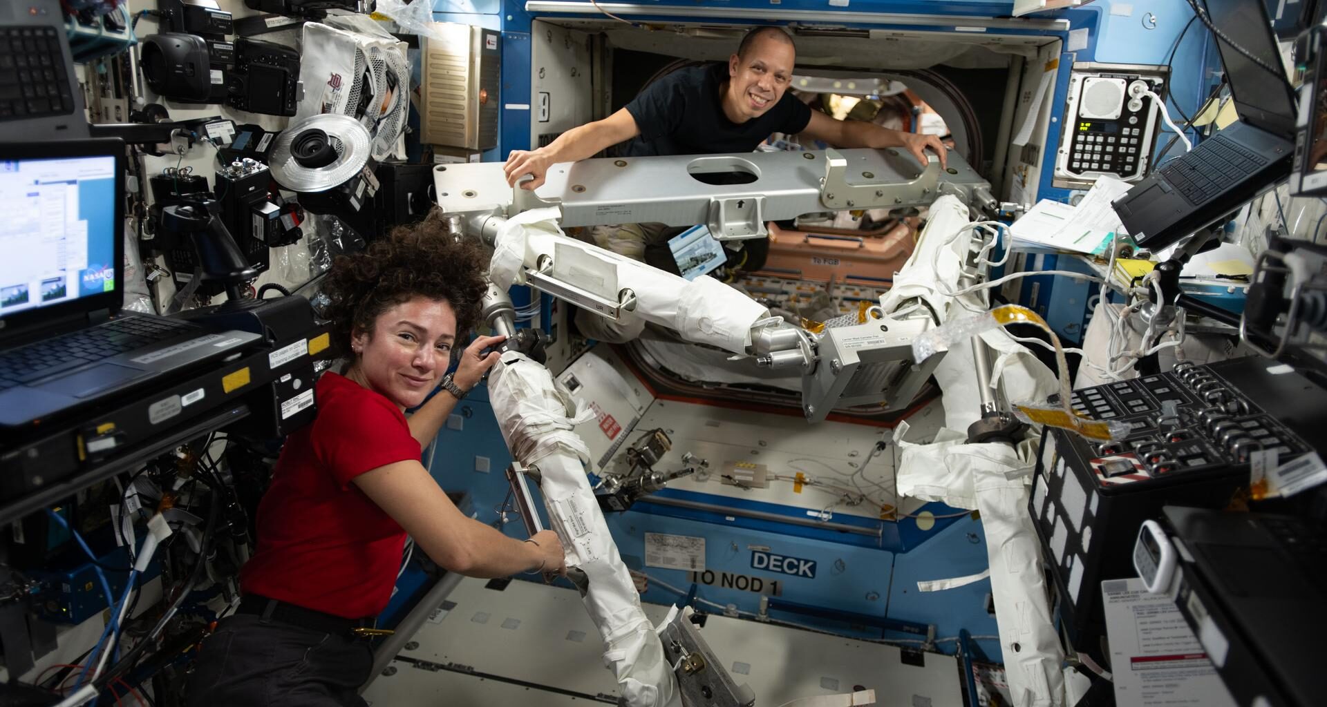 NASA astronauts Jessica Meir and Chris Williams, both Expedition 74 flight engineers, familiarize themselves with the hardware they will use to install a modification kit and route cables on the port side of the International Space Station. The duo will conduct a spacewalk using the hardware to prepare the orbital outpost for a future roll‑out solar array that will be installed during a later spacewalk.