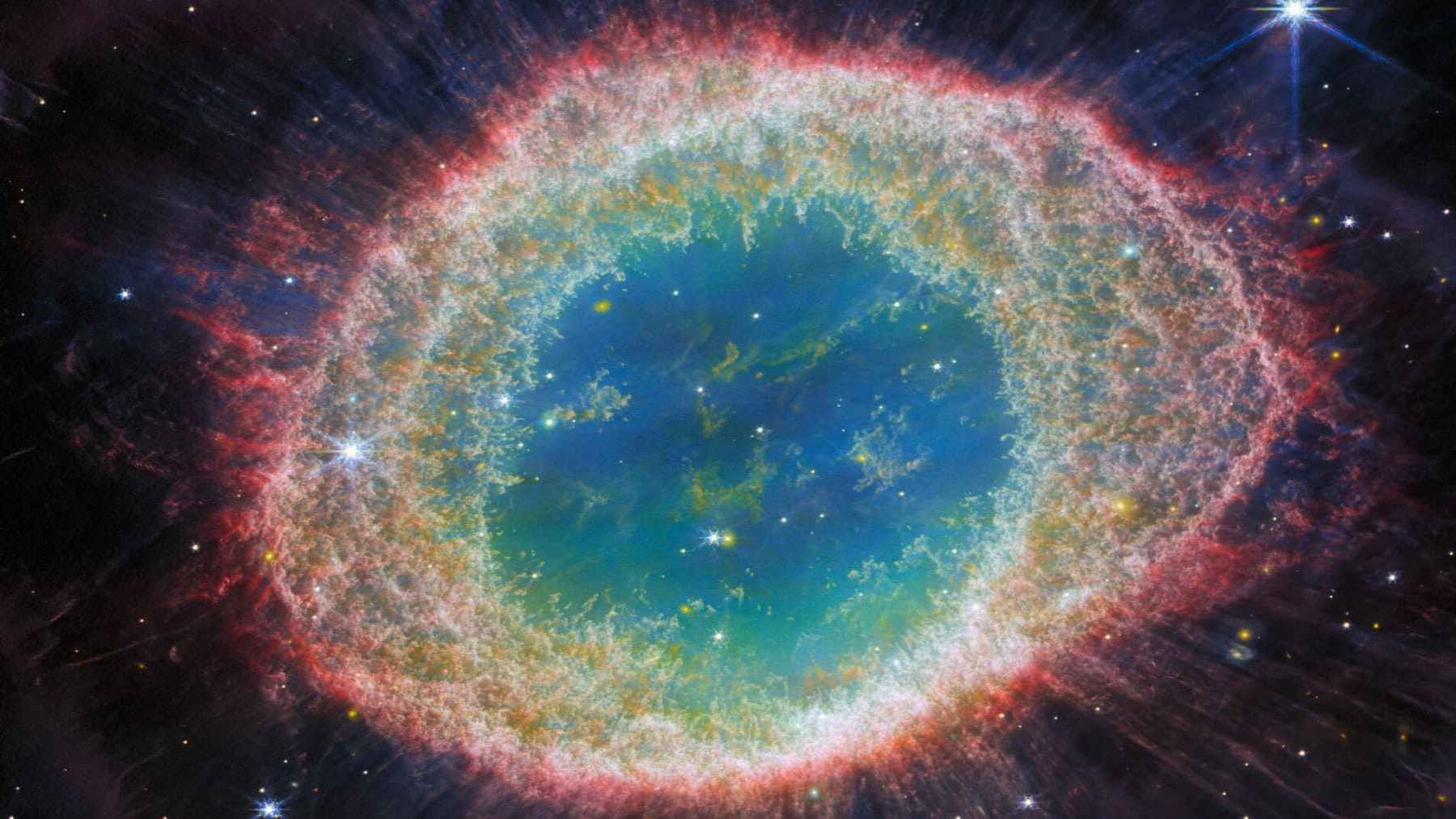 Helix Nebula infrared image by James Webb showing glowing gas rings from a dying Sun-like star